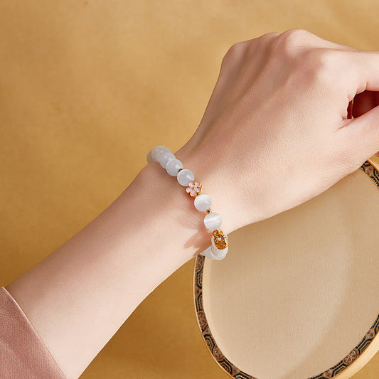 Satori Totem Sterling Silver Natural Peach Blossom White Cat's Eye Bracelet